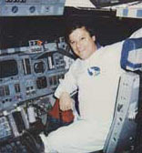 McClelland in the cockpit of the space shuttle